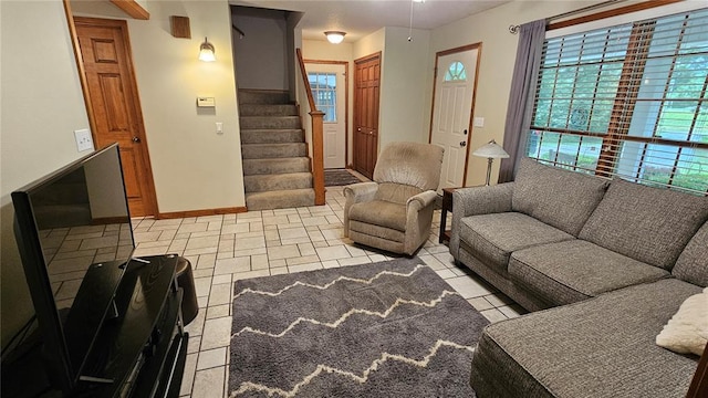 189 County Road 657, Cape Girardeau, MO 63701 - living room with stairs, tile patterned floors, and baseboards