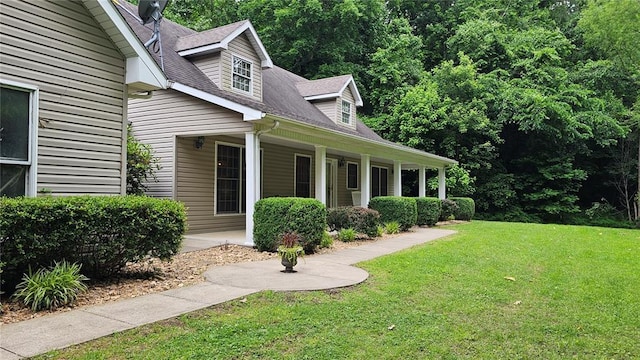 189 County Road 657, Cape Girardeau, MO 63701 - view of home's exterior with a yard, covered porch, and roof with shingles