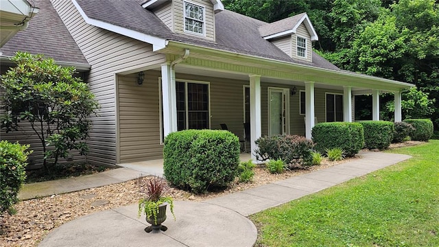 189 County Road 657, Cape Girardeau, MO 63701 - view of front facade with covered porch, roof with shingles, and a front yard