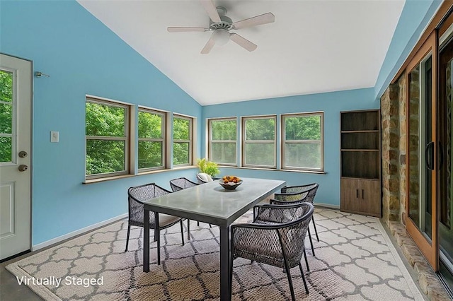 sunroom featuring vaulted ceiling and healthy amount of natural light