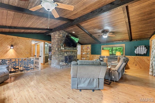 254 Rustic Hills Ln, Jackson, MO 63755 - living area with ceiling fan, wooden walls, wooden ceiling, wood finished floors, and a wainscoted wall