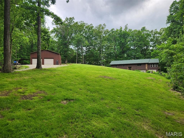 254 Rustic Hills Ln, Jackson, MO 63755 - view of green lawn with a garage and an outbuilding