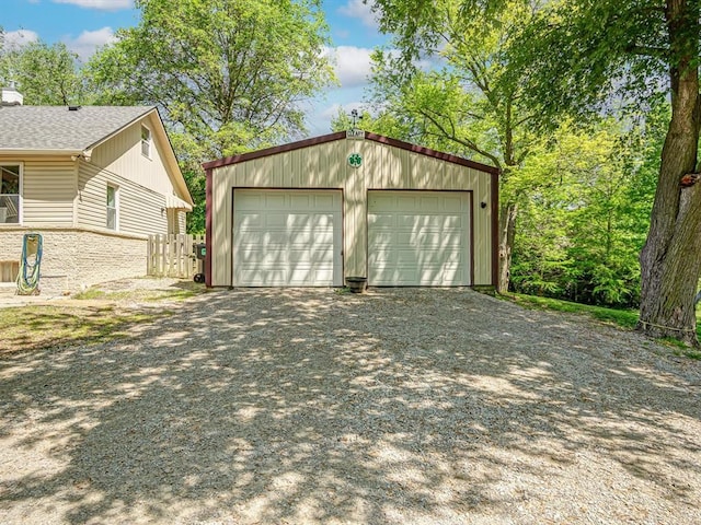 detached garage featuring driveway
