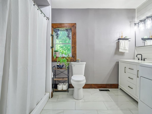 bathroom with washer / clothes dryer, marble finish floors, toilet, a shower with shower curtain, and vanity