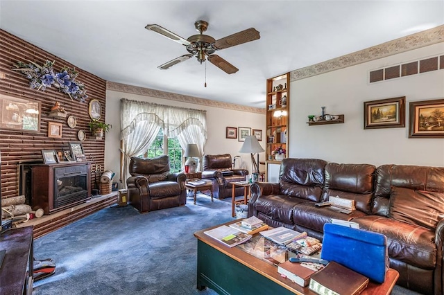 717 W Clement St, De Soto, MO 63020 - living room with carpet flooring, a ceiling fan, and a fireplace