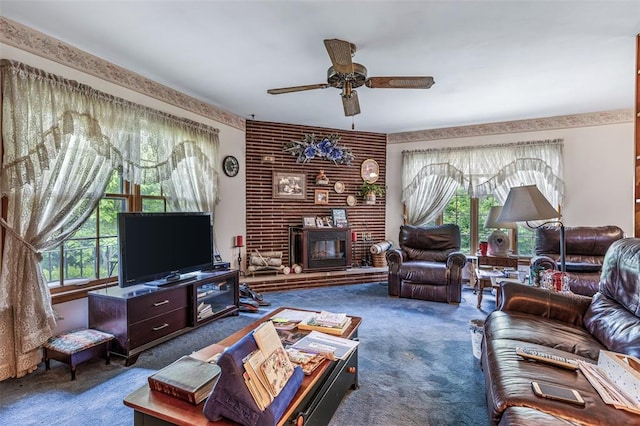 717 W Clement St, De Soto, MO 63020 - carpeted living area with a ceiling fan and a fireplace