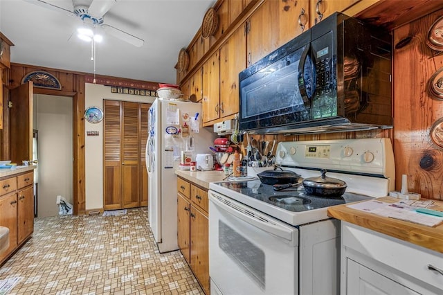 717 W Clement St, De Soto, MO 63020 - kitchen featuring white appliances, ceiling fan, light countertops, and brown cabinets