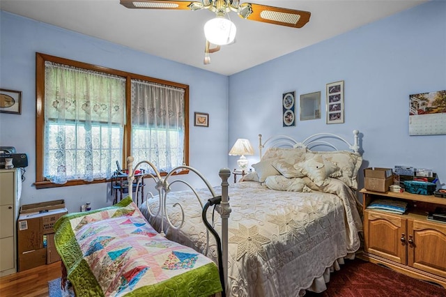 717 W Clement St, De Soto, MO 63020 - bedroom with dark wood-style flooring and a ceiling fan