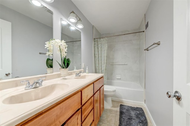bathroom featuring tile patterned flooring, shower / bath combo with shower curtain, double vanity, toilet, and baseboards