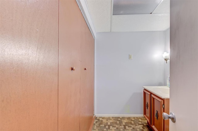 bathroom featuring vanity and baseboards