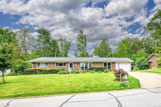 ranch-style house with a garage, concrete driveway, brick siding, and a front lawn