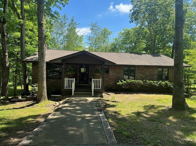 267 Misty Lake Rd, Poplar Bluff, MO 63901 - view of front of property featuring brick siding, a front lawn, and covered porch