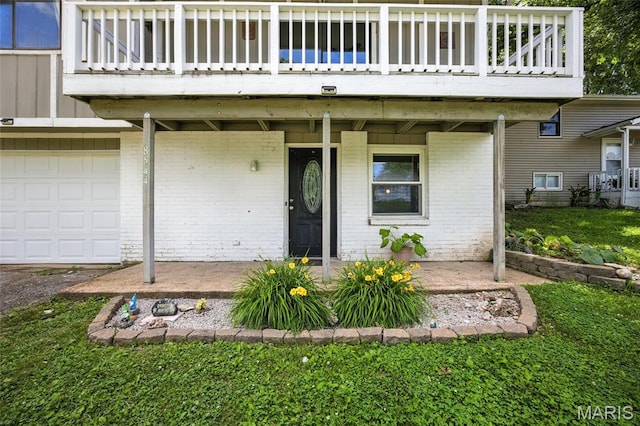 8544 Lake Dr, Cedar Hill, MO 63016 - property entrance with brick siding, an attached garage, and a yard