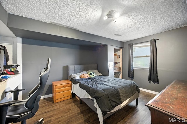 8544 Lake Dr, Cedar Hill, MO 63016 - bedroom featuring a textured ceiling and wood finished floors