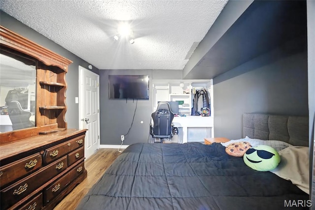 8544 Lake Dr, Cedar Hill, MO 63016 - bedroom with wood finished floors and a textured ceiling