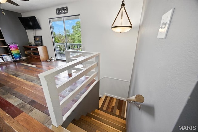 8544 Lake Dr, Cedar Hill, MO 63016 - stairs featuring a ceiling fan and wood finished floors