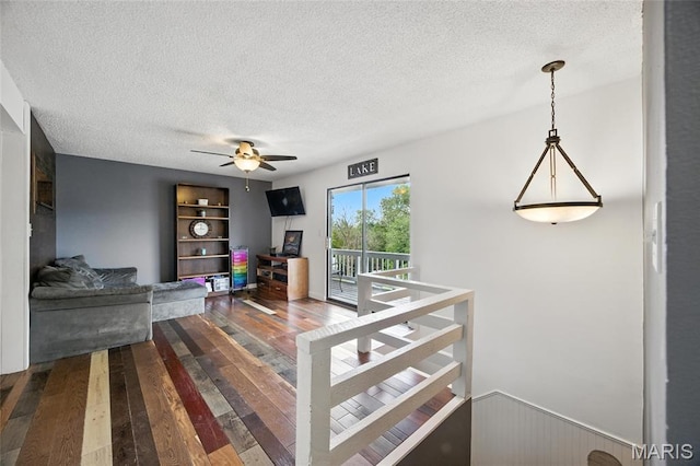 8544 Lake Dr, Cedar Hill, MO 63016 - living room featuring a textured ceiling, hardwood / wood-style floors, and ceiling fan