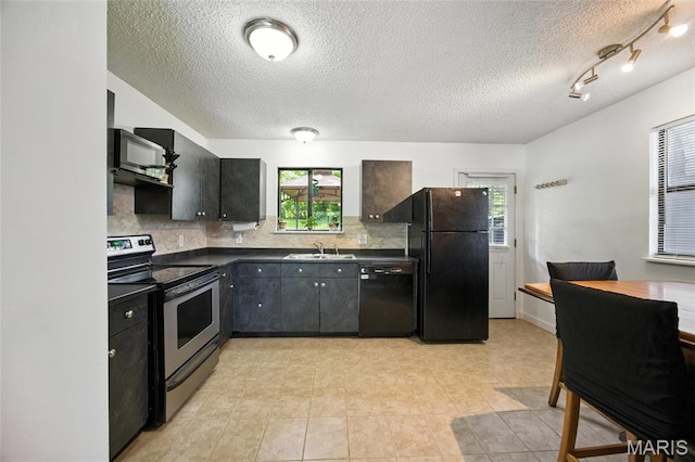 8544 Lake Dr, Cedar Hill, MO 63016 - kitchen with black appliances, dark countertops, tasteful backsplash, a textured ceiling, and light tile patterned floors