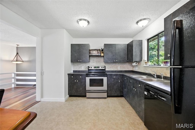 8544 Lake Dr, Cedar Hill, MO 63016 - kitchen featuring black appliances, dark countertops, decorative backsplash, a textured ceiling, and dark cabinets