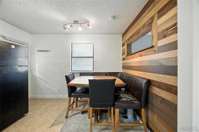8544 Lake Dr, Cedar Hill, MO 63016 - dining area with a textured ceiling and light tile patterned floors