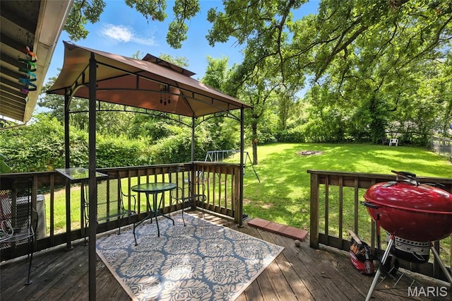8544 Lake Dr, Cedar Hill, MO 63016 - wooden terrace with a grill, a lawn, a gazebo, and view of wooded area