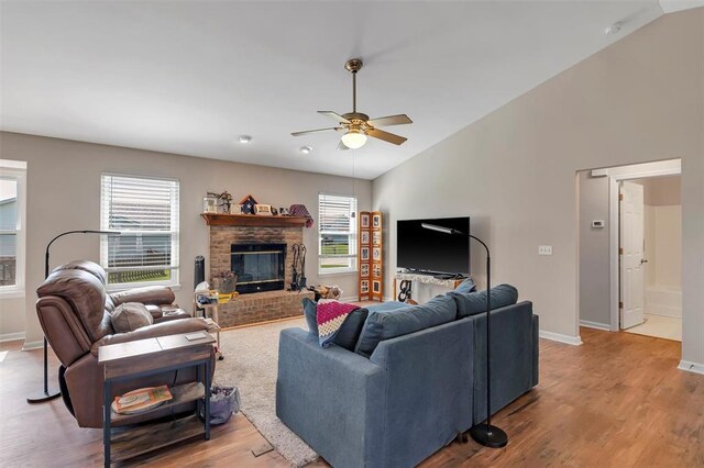 140 Glen Forest Dr, Troy, MO 63379 - living room with vaulted ceiling, healthy amount of natural light, ceiling fan, wood finished floors, and a brick fireplace