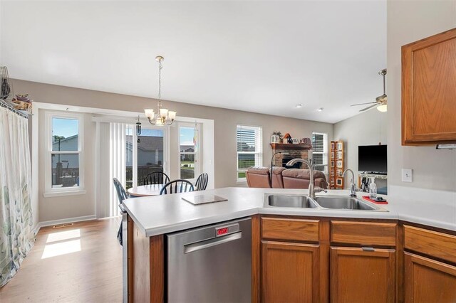 140 Glen Forest Dr, Troy, MO 63379 - kitchen featuring stainless steel dishwasher, a sink, healthy amount of natural light, and a chandelier