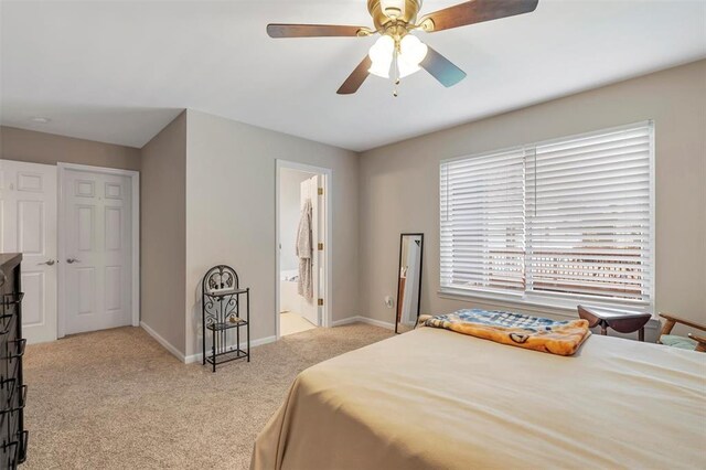 140 Glen Forest Dr, Troy, MO 63379 - bedroom with carpet floors, baseboards, ceiling fan, and ensuite bathroom
