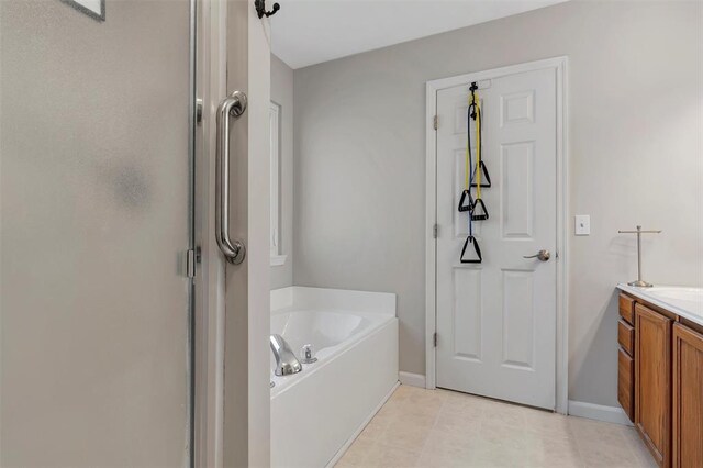 140 Glen Forest Dr, Troy, MO 63379 - bathroom featuring a garden tub, a stall shower, baseboards, and vanity