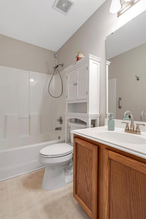 140 Glen Forest Dr, Troy, MO 63379 - bathroom featuring toilet, vanity, shower / washtub combination, and tile patterned flooring