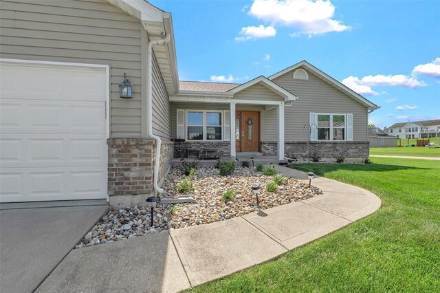 140 Glen Forest Dr, Troy, MO 63379 - view of front of house featuring brick siding, a front lawn, a porch, and a garage
