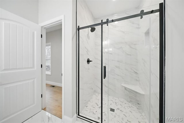 31998 Fairway Dr N, Foristell, MO 63348 - bathroom with marble look tile flooring and a marble finish shower