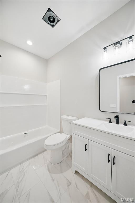 31998 Fairway Dr N, Foristell, MO 63348 - bathroom featuring vanity, marble finish floors, recessed lighting, and bathing tub / shower combination