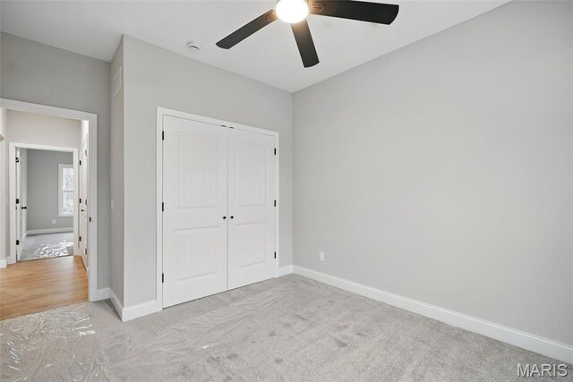 31998 Fairway Dr N, Foristell, MO 63348 - unfurnished bedroom featuring carpet, a closet, and ceiling fan