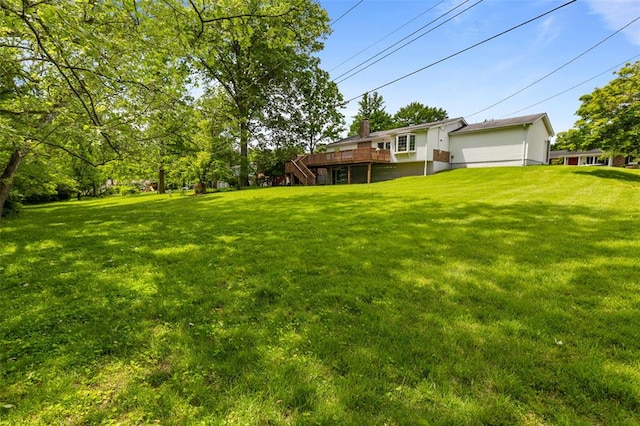 308 Wildbrier Dr, Ballwin, MO 63011 - view of green lawn with a deck, a garage, and stairway