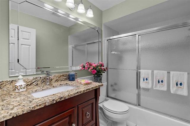 308 Wildbrier Dr, Ballwin, MO 63011 - full bathroom with vanity, bath / shower combo with glass door, and toilet