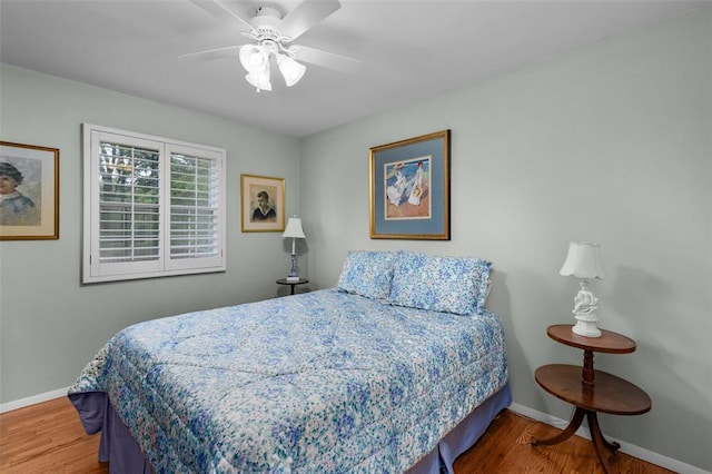 308 Wildbrier Dr, Ballwin, MO 63011 - bedroom featuring baseboards, wood finished floors, and a ceiling fan