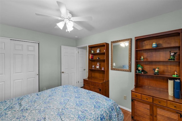 308 Wildbrier Dr, Ballwin, MO 63011 - bedroom featuring wood finished floors, a closet, ceiling fan, and baseboards
