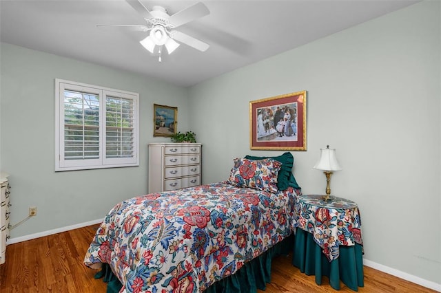308 Wildbrier Dr, Ballwin, MO 63011 - bedroom featuring wood finished floors, baseboards, and a ceiling fan