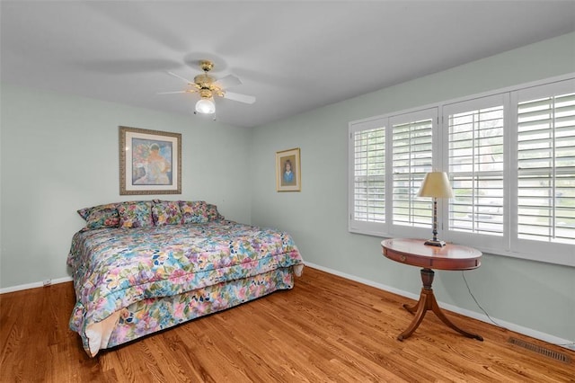 308 Wildbrier Dr, Ballwin, MO 63011 - bedroom with baseboards, wood finished floors, and a ceiling fan