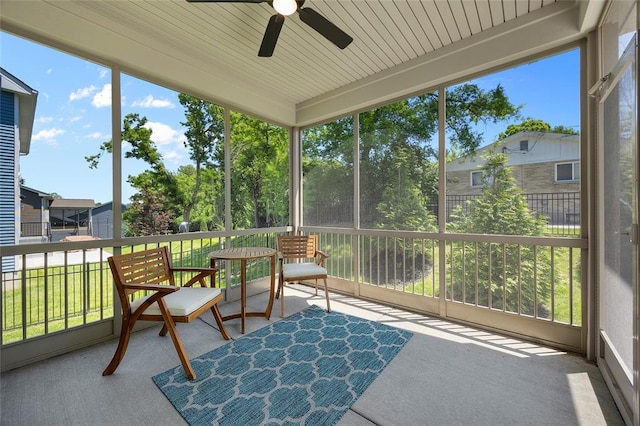 sunroom featuring ceiling fan and healthy amount of natural light