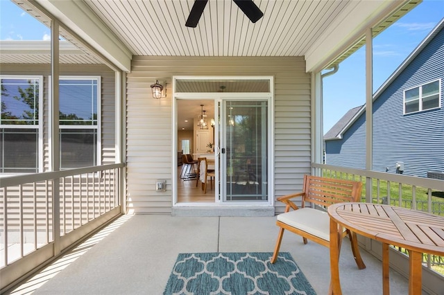 sunroom / solarium with a ceiling fan and healthy amount of natural light