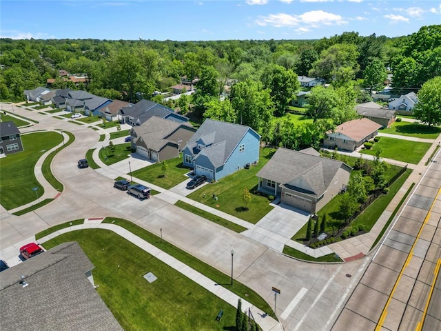 aerial perspective of suburban area featuring a forest