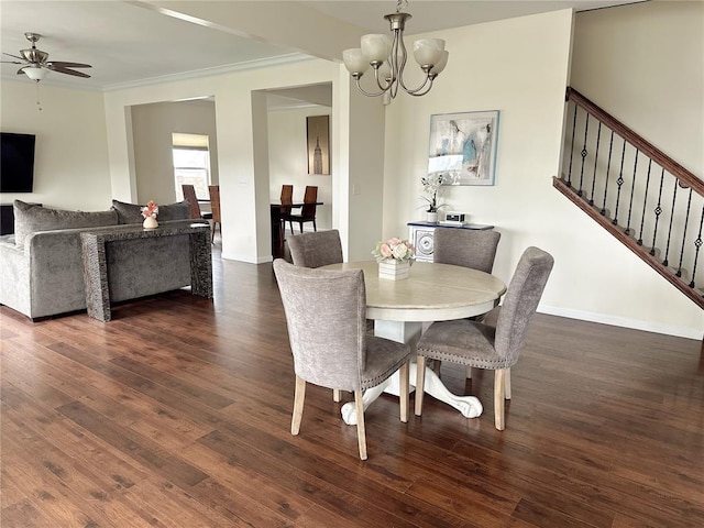 dining area with hardwood / wood-style flooring, stairway, a chandelier, crown molding, and baseboards