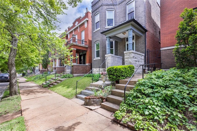 4526 Gibson Ave, Saint Louis, MO 63110 - view of front of house featuring brick siding and stairway