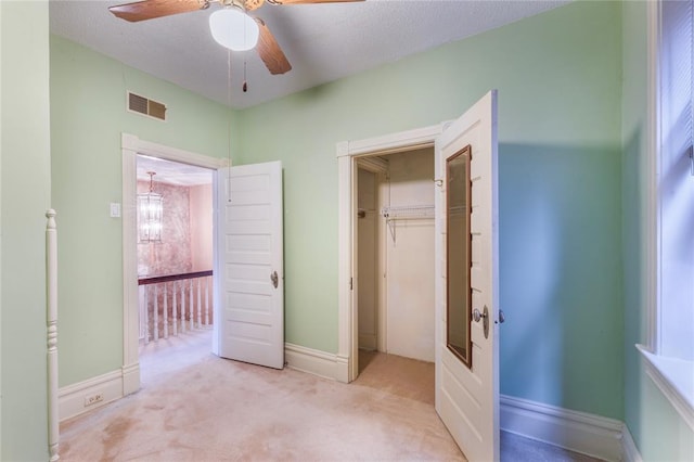 4526 Gibson Ave, Saint Louis, MO 63110 - unfurnished bedroom with carpet, baseboards, ceiling fan, and a closet