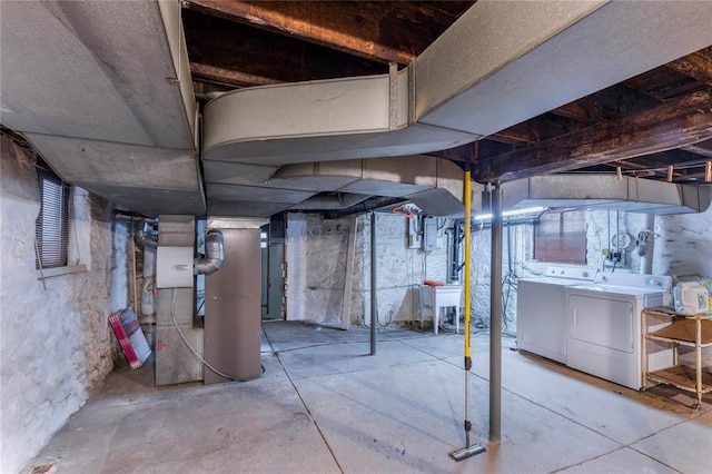 4526 Gibson Ave, Saint Louis, MO 63110 - unfinished basement featuring washer and clothes dryer