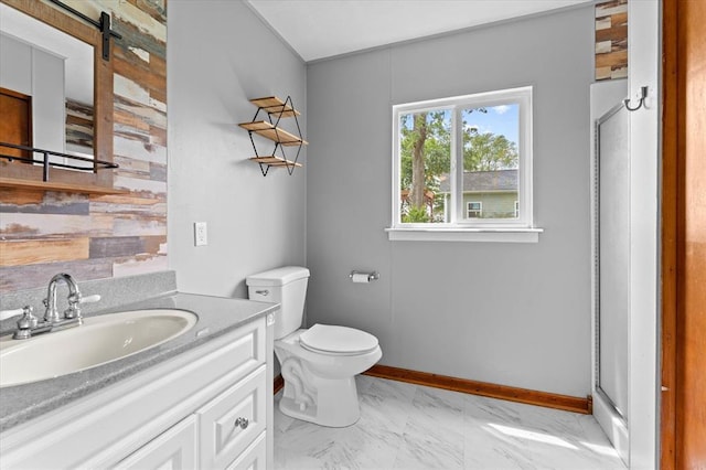 bathroom featuring marble look tile flooring, vanity, toilet, baseboards, and a shower stall