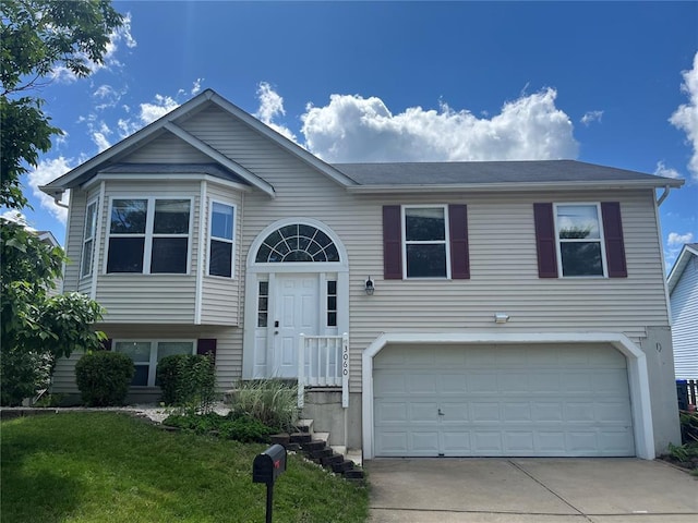 3060 Laurel Village Cir, Saint Peters, MO 63376 - split foyer home featuring an attached garage, driveway, and a front lawn