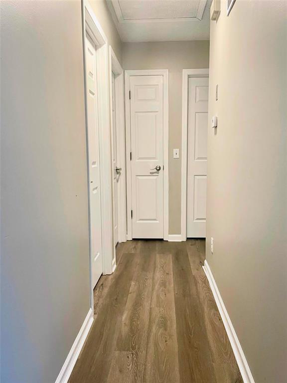 3060 Laurel Village Cir, Saint Peters, MO 63376 - corridor with dark wood-style flooring and baseboards